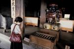 Woman praying in temple